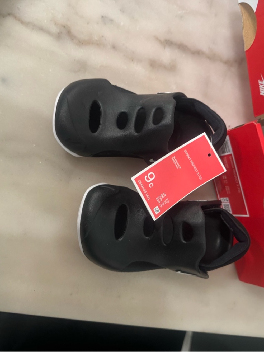 Nike Kids Black and White Slip-On Sandals with Vent Cutouts